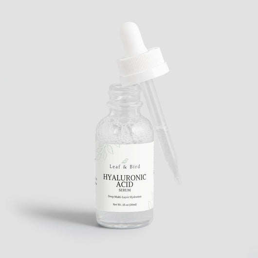 Hyaluronic Acid Serum bottle open with the dropper resting on the rim