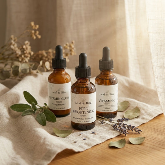 Leaf & Bird Brightening Set skincare bundle — 3 products on linen with botanicals