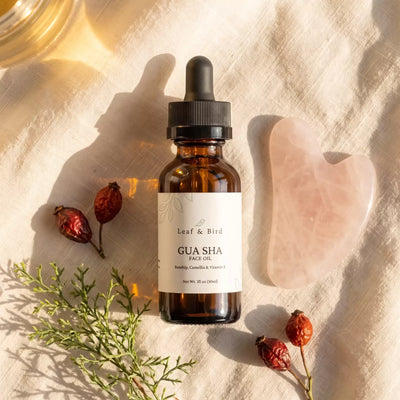 Leaf & Bird Gua Sha Face Oil on linen with a rose quartz gua sha stone and rosehips