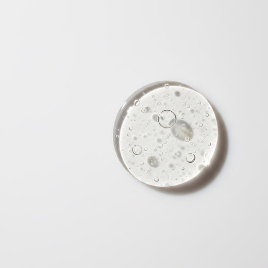 Vegan PDRN Brightening Serum — macro shot of serum drop