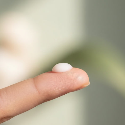Vitamin Glow Serum — formula texture, drop on fingertip